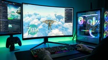 Игровой компьютер с двумя экранами, на одном показана игра The Legend of Zelda.